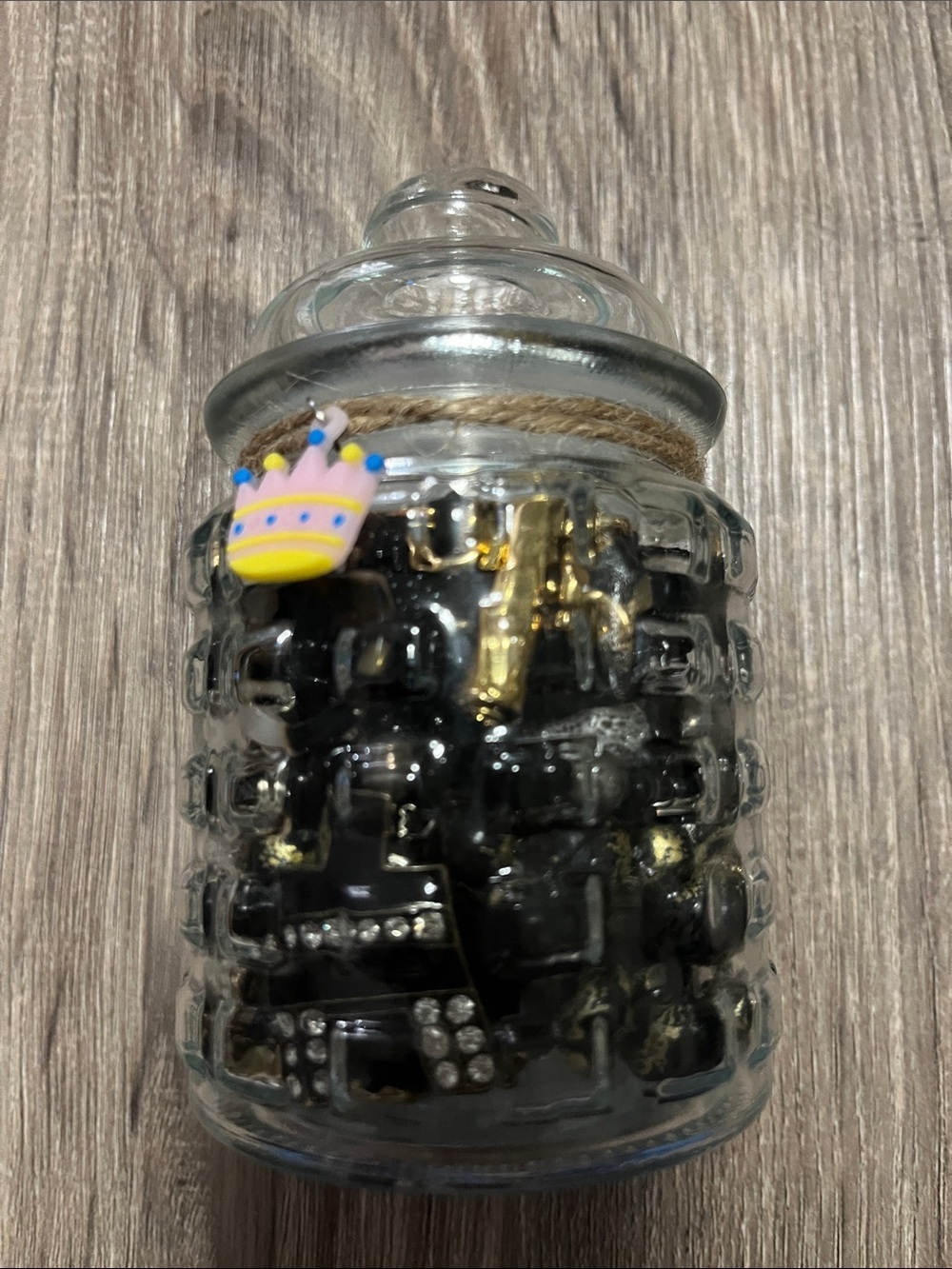 Glass Jar Filled with Black and Gold jewelry